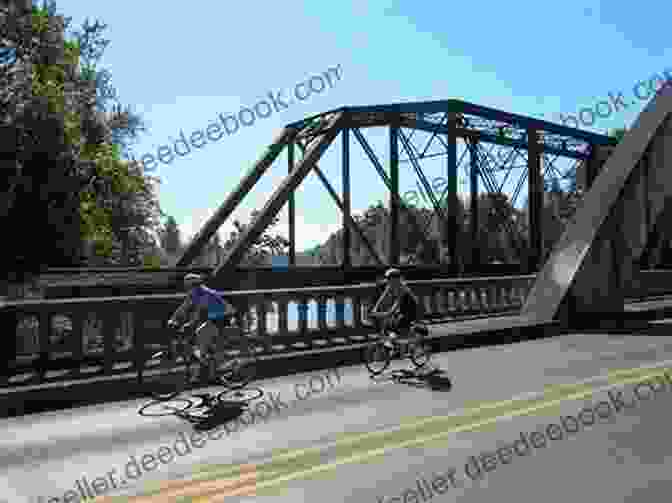 A Group Of Cyclists Riding Along The Willamette River Waterfront, With The City Skyline In The Background. Went To Portland: An American Journey In Photos