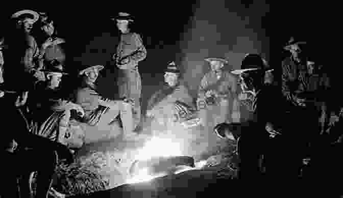 A Group Of Soldiers Singing Around A Campfire During World War I. Singing Soldiering And Sheet Music In America During The First World War