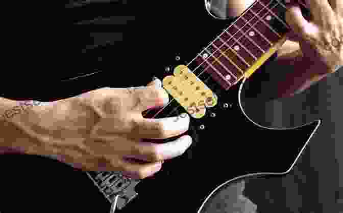 A Guitar Player Using The Berklee Basic Guitar Phase Technique Berklee Basic Guitar Phase 2: Guitar Technique