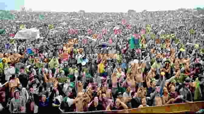 A Large Crowd Of People At The Woodstock Music Festival Woodstock: 50 Years Of Peace And Music