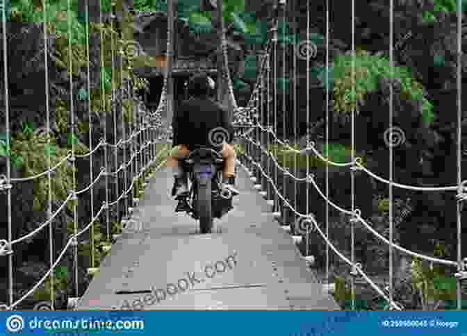 Motorcyclist Crossing A Suspension Bridge A MOTORCYCLE ODYSSEY CAPE TOWN TO SINGAPORE